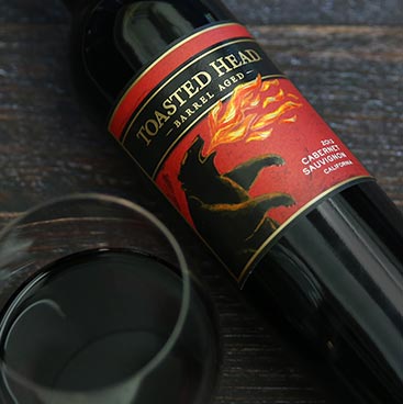 Bottle of Untamed Red laying on a table